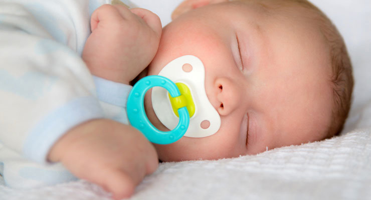 Baby sleeping with store dummy